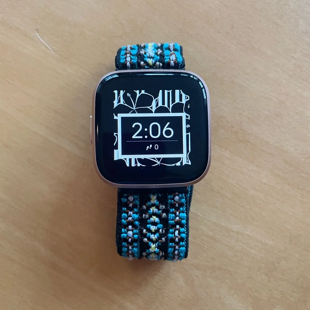 Fitbit Versa. Used once. Rose gold with original pink band